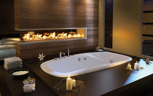 A Fireplace Next to the Bathtub